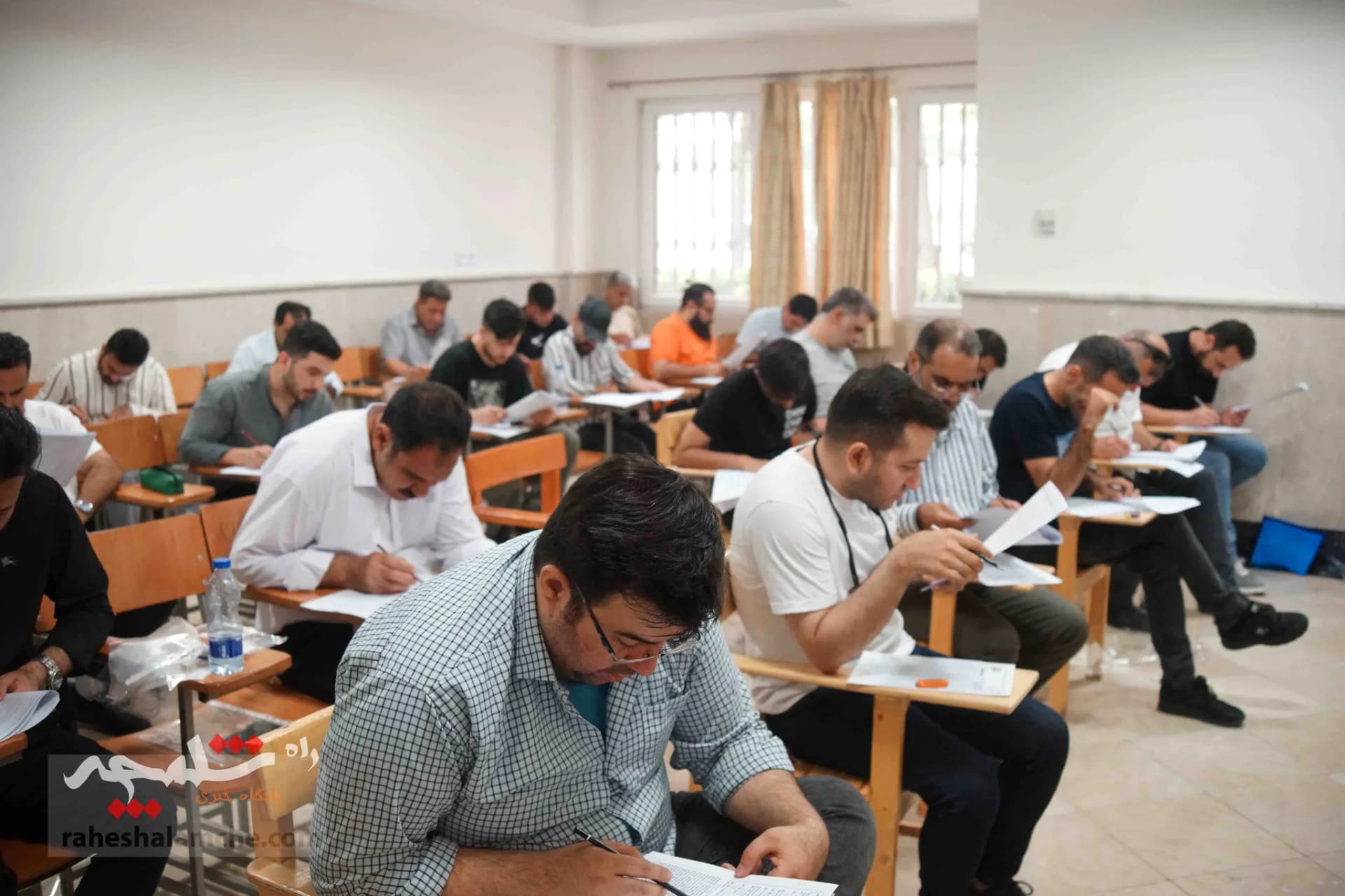 آزمون استخدامی فرزندان شهدا و جانبازان +تصاویر — تصویر 18